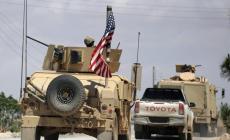 آليات عسكرية أميركية في مينبج حيث تدعم واشنطن حلفاءها في شمال شرق سوريا (رويترز)