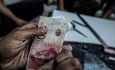 كيف شلّ نقص العملات الصغيرة حياة مليوني إنسان في غزة؟