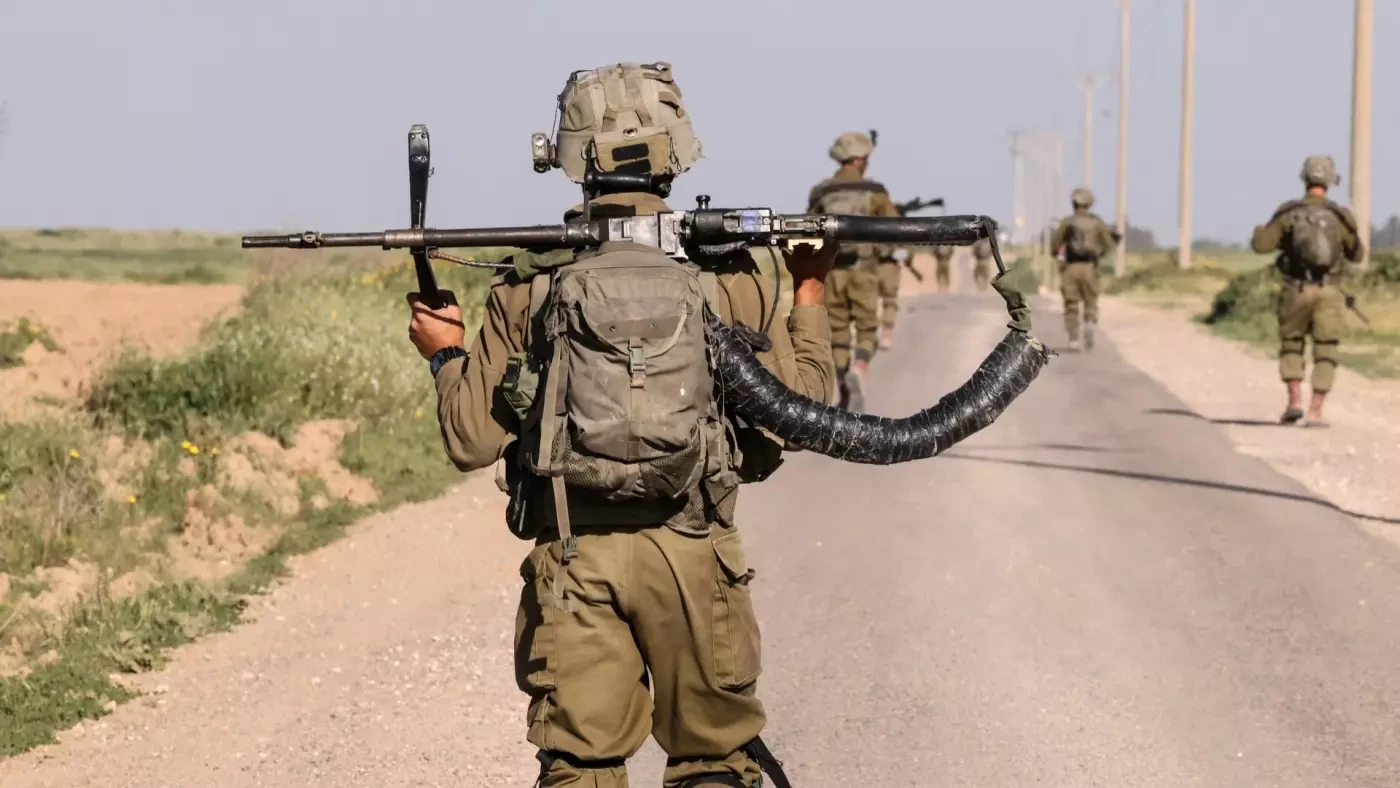 Israeli soldiers walk near the border with Gaza Strip in southern Israel on March 12, 2024-afp.jpg.webp